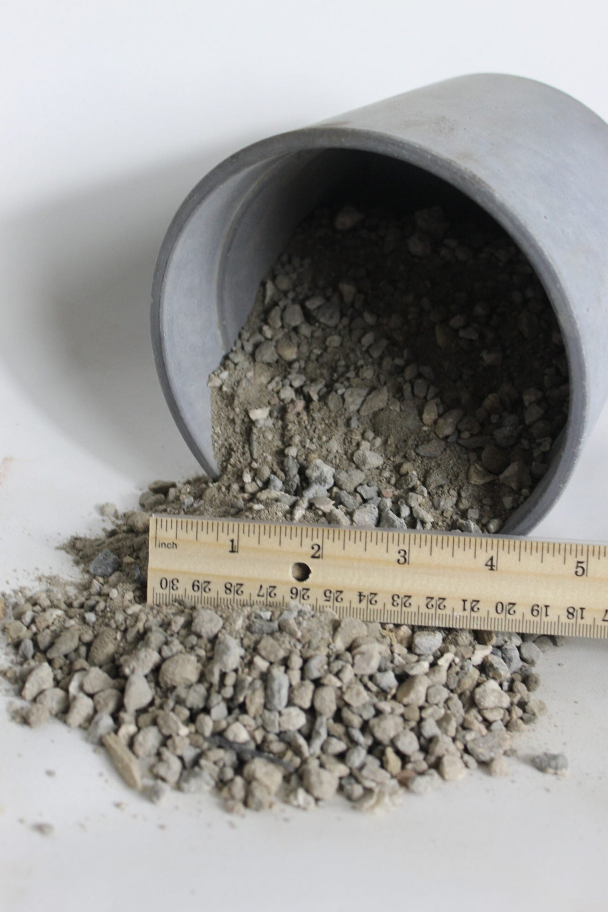 crush crete falling out of bucket measured