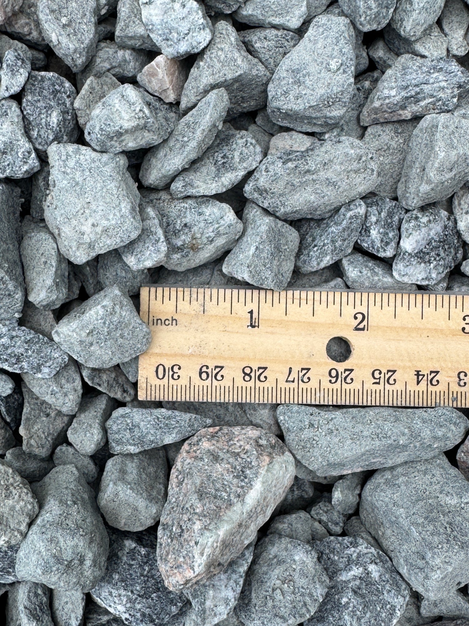 ruler compared next to granite rocks