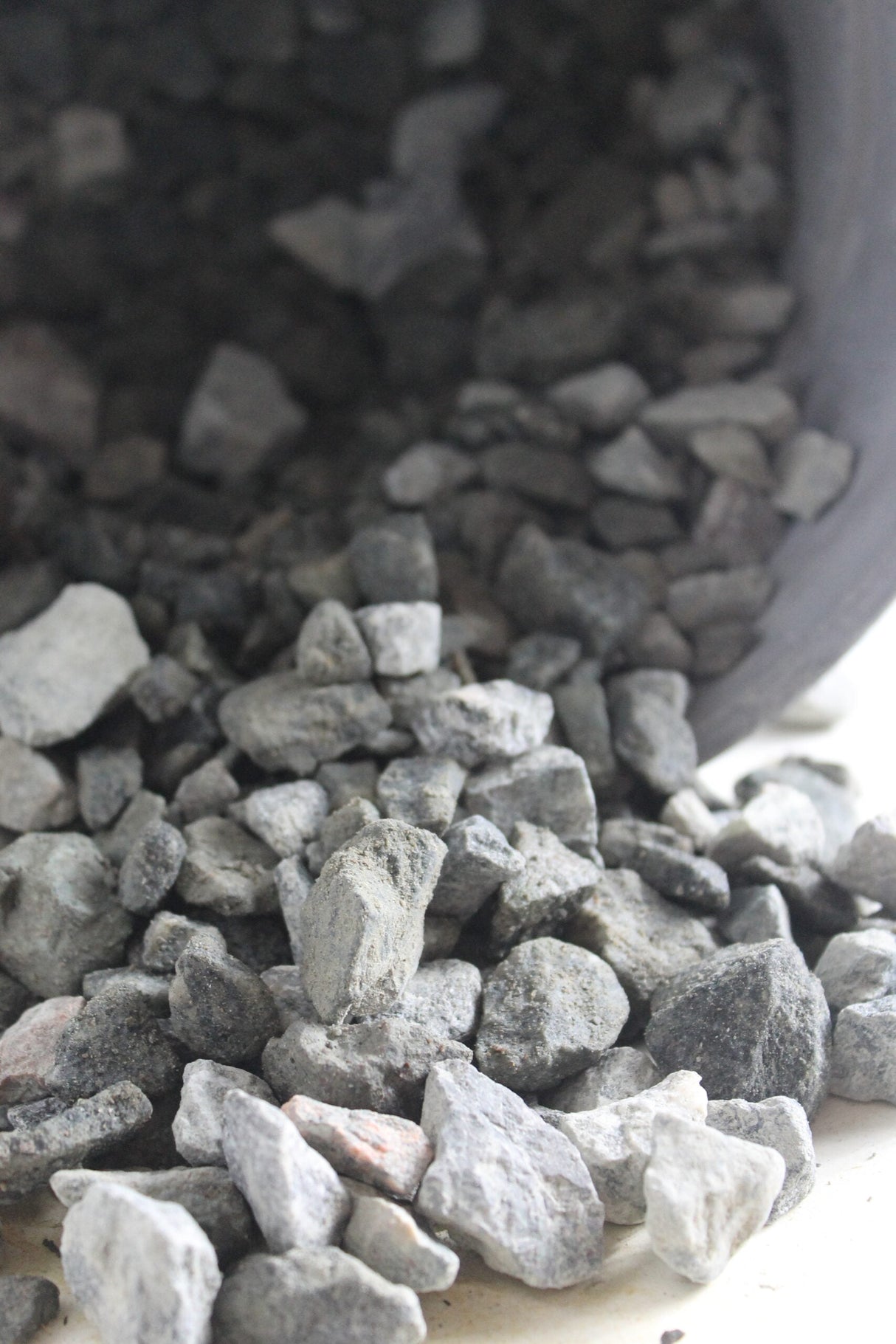 granite rocks falling out of bucket