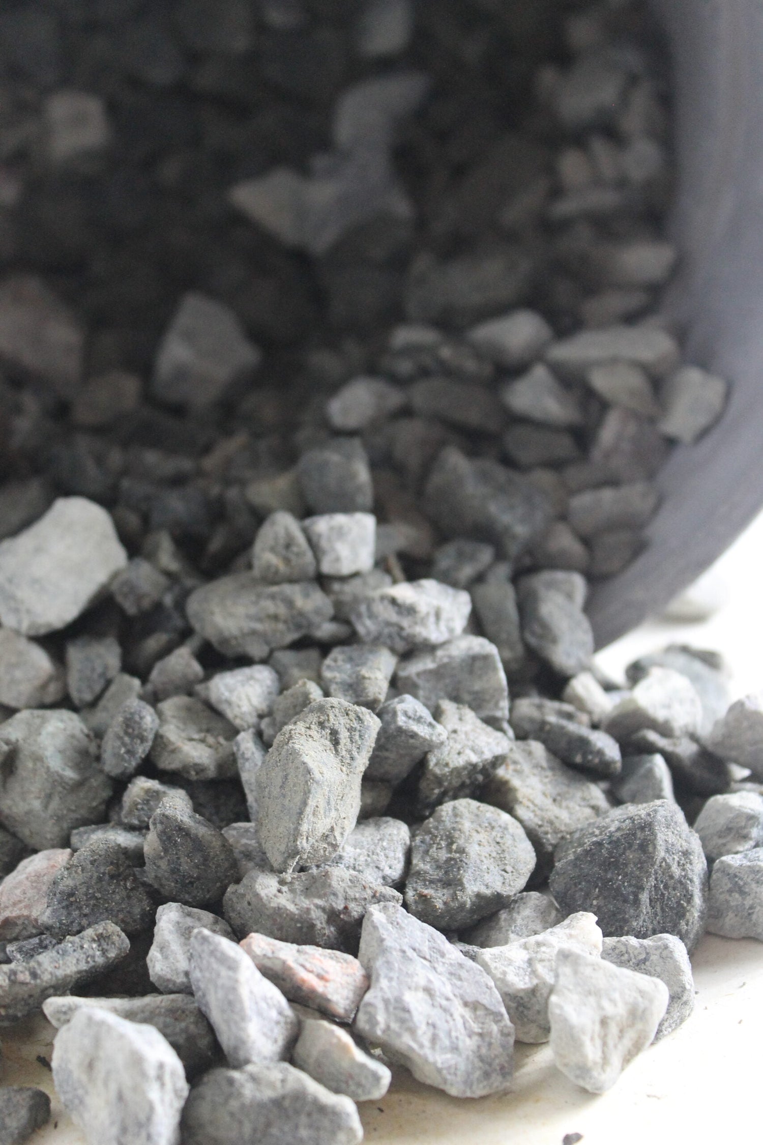 granite rocks falling out of bucket
