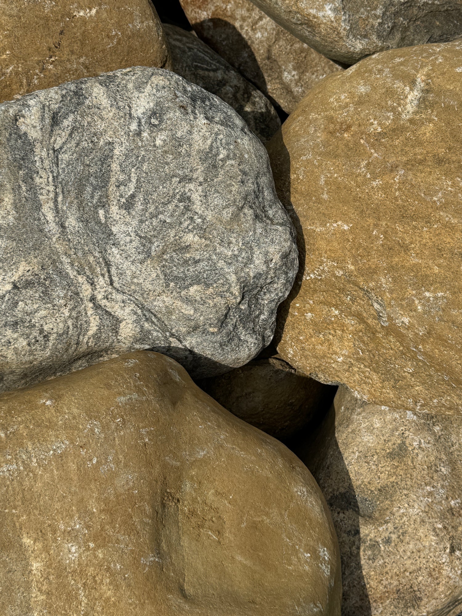 Close-up of textured stones with varying shades of brown and gray.