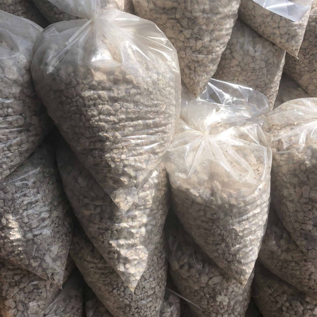 stacked bags of limestone rock