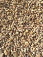colors of pink, white, and beige make up a pile of white pea gravel