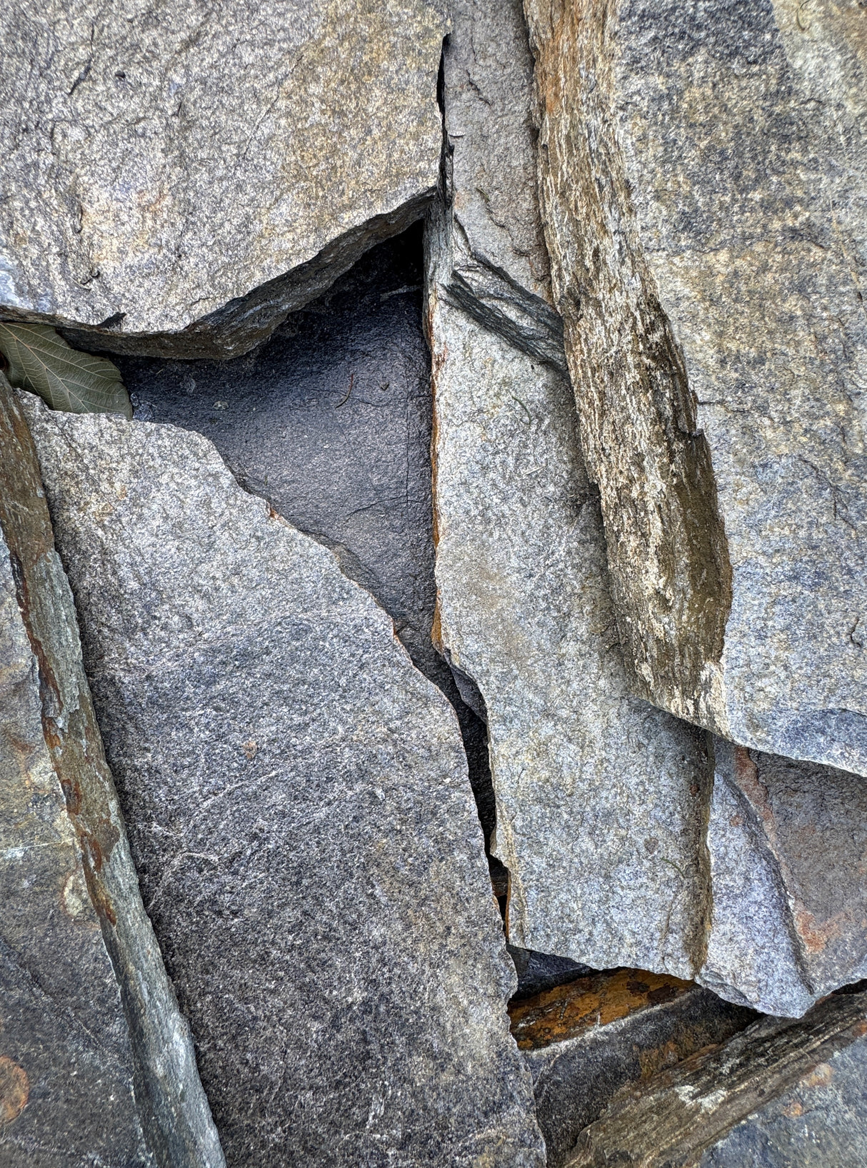 Close-up of silver and brown rocks stacked at Liberty Landscape Supply