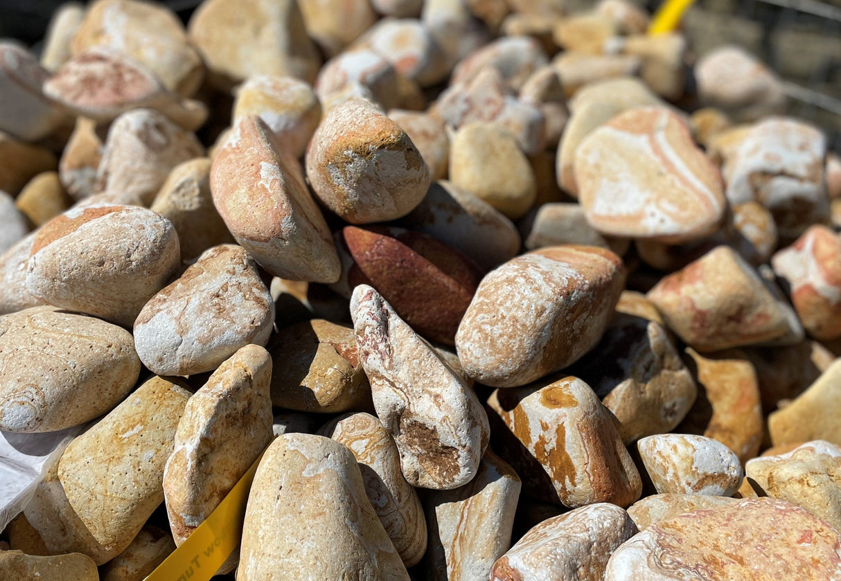 Heap of multicolored stones with a blurred background