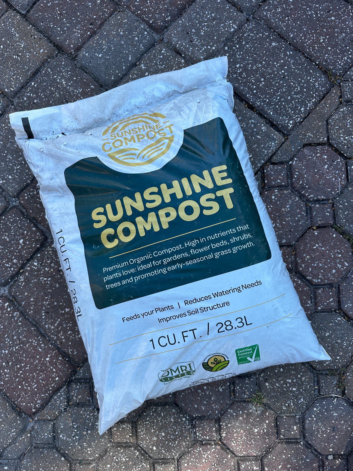 Bag of Sunshine Compost on a textured surface