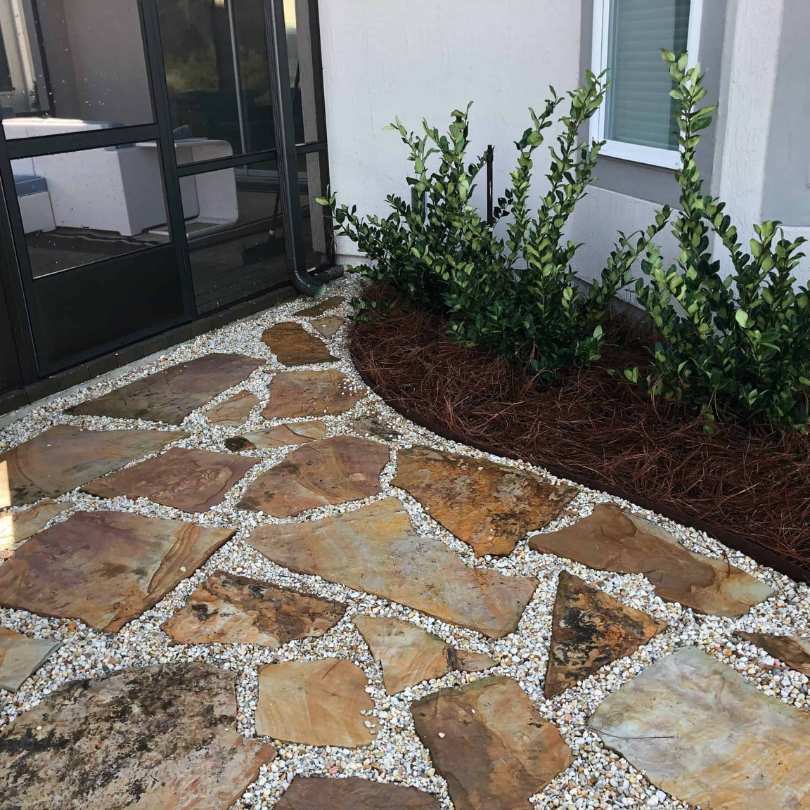 white pea gravel shown in landscape design