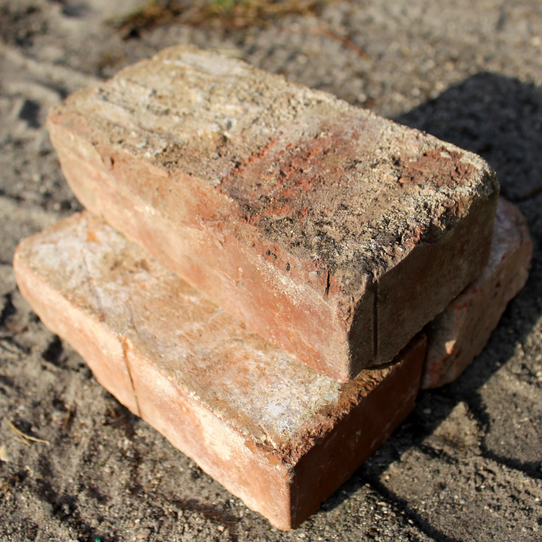 antique brick stacked in pile of three