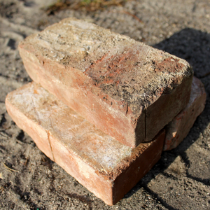 antique brick stacked in pile of three