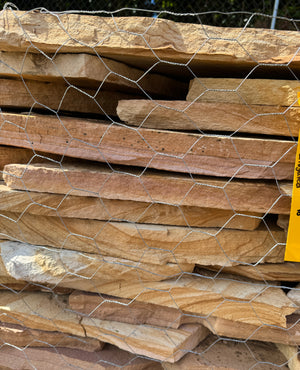 stack of brown variegated flagstone showing thickness 