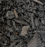 Close-up of dark compost with nutrients and organic matter