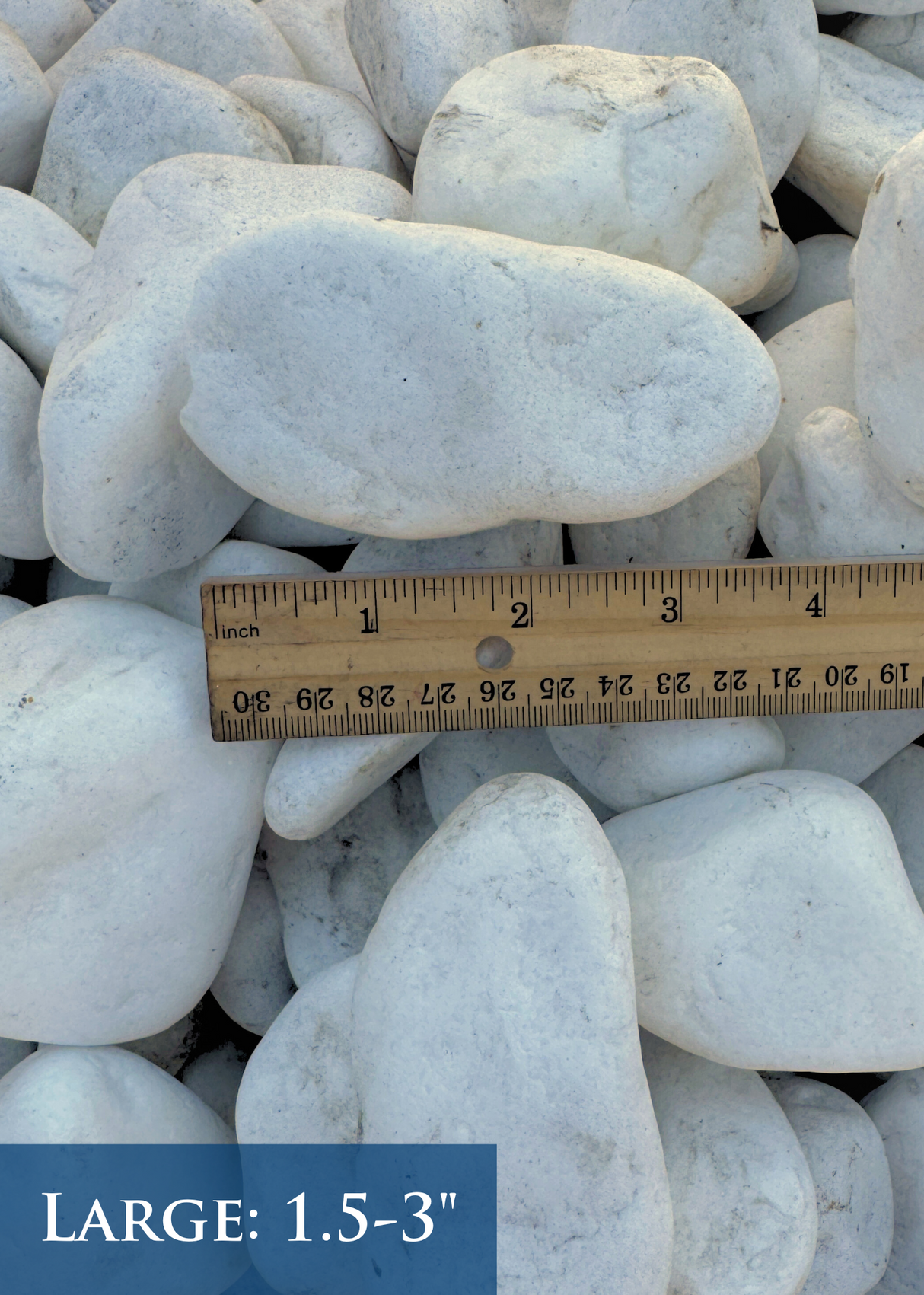 White stones with a ruler showing size measurement on a white background