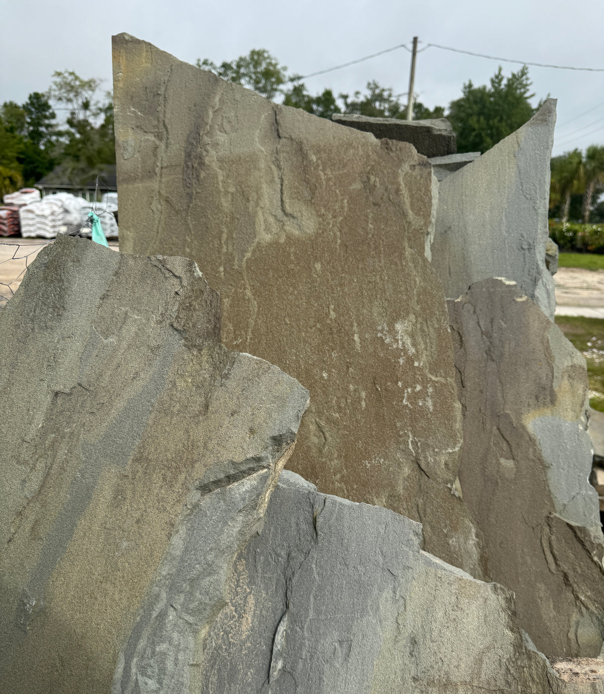 Large stone slabs with a natural texture in an outdoor setting