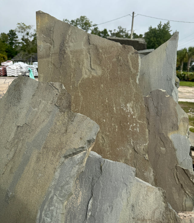 Large stone slabs with a natural texture in an outdoor setting