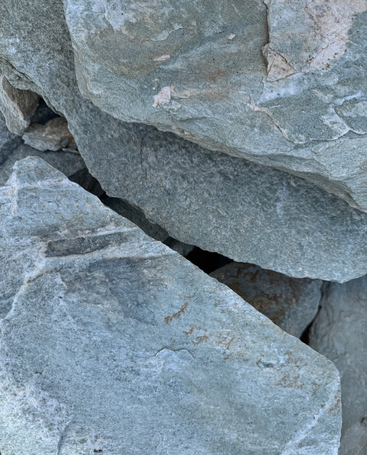 Close-up of gray-green stone blocks with visible texture