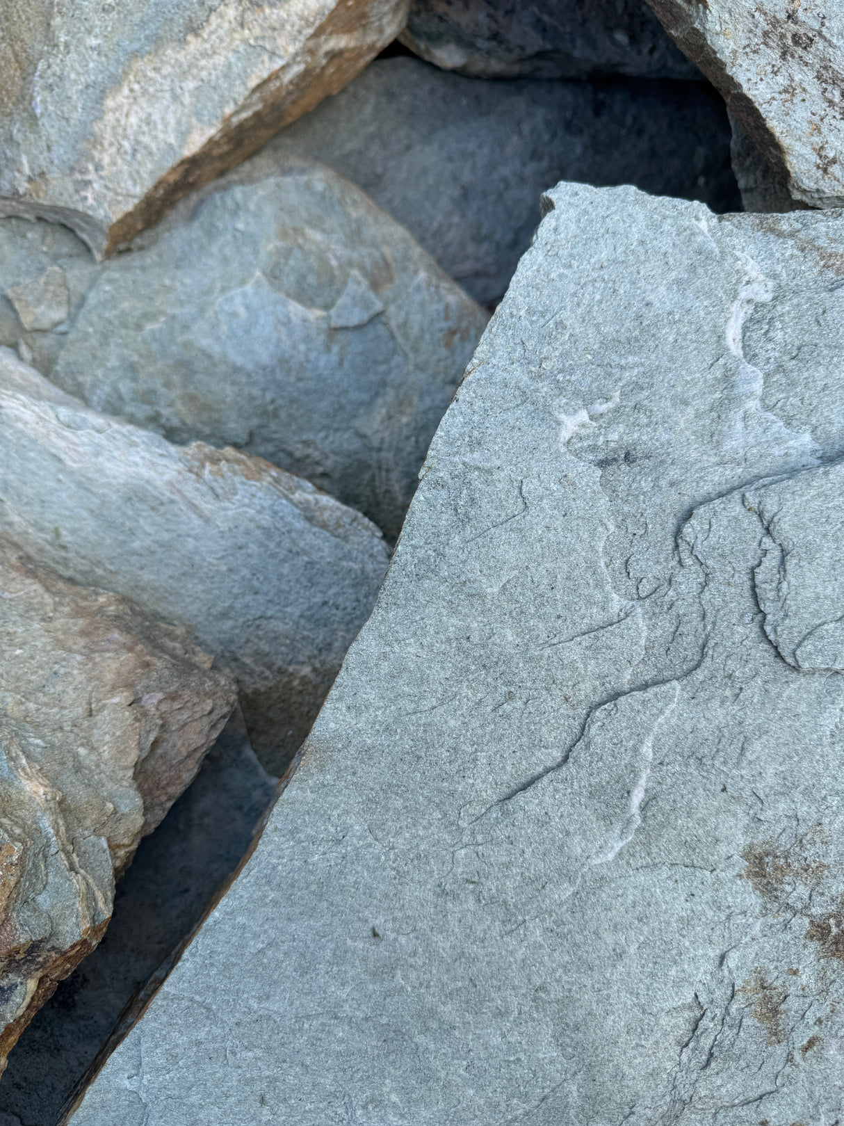 Close-up of textured sea mist flagstone surface